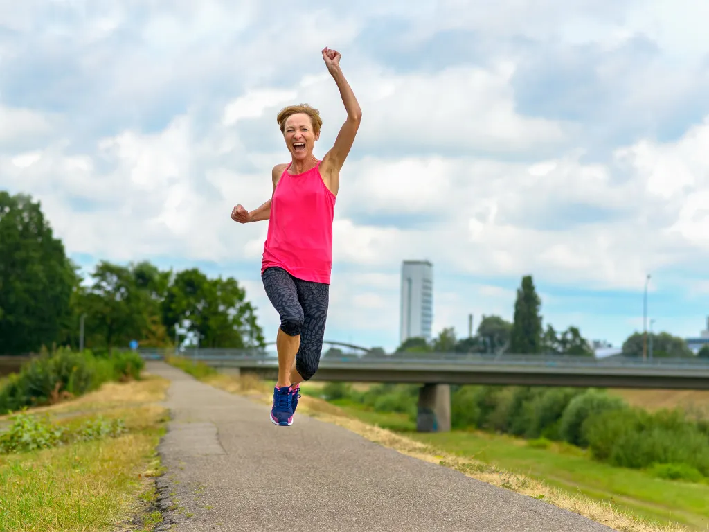 happy healthy woman jogging
