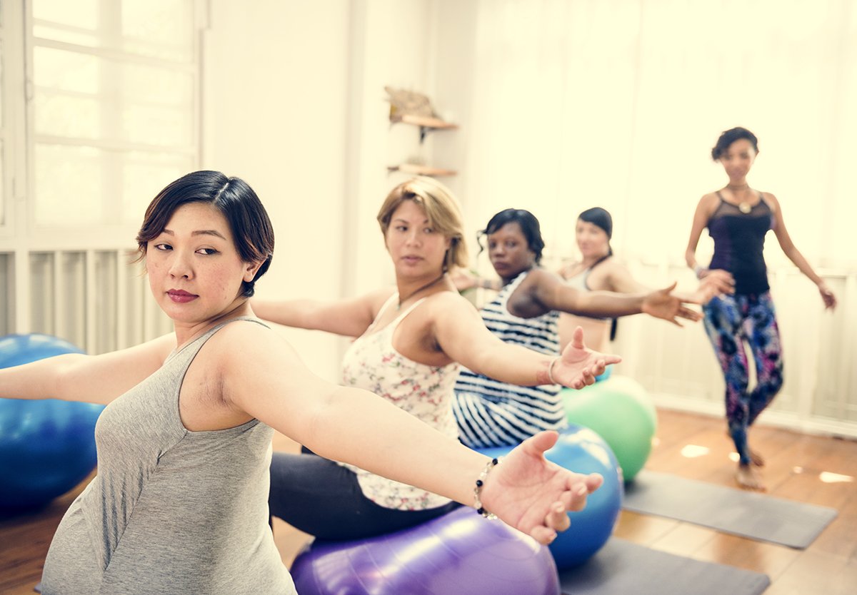pregnant women in yoga class