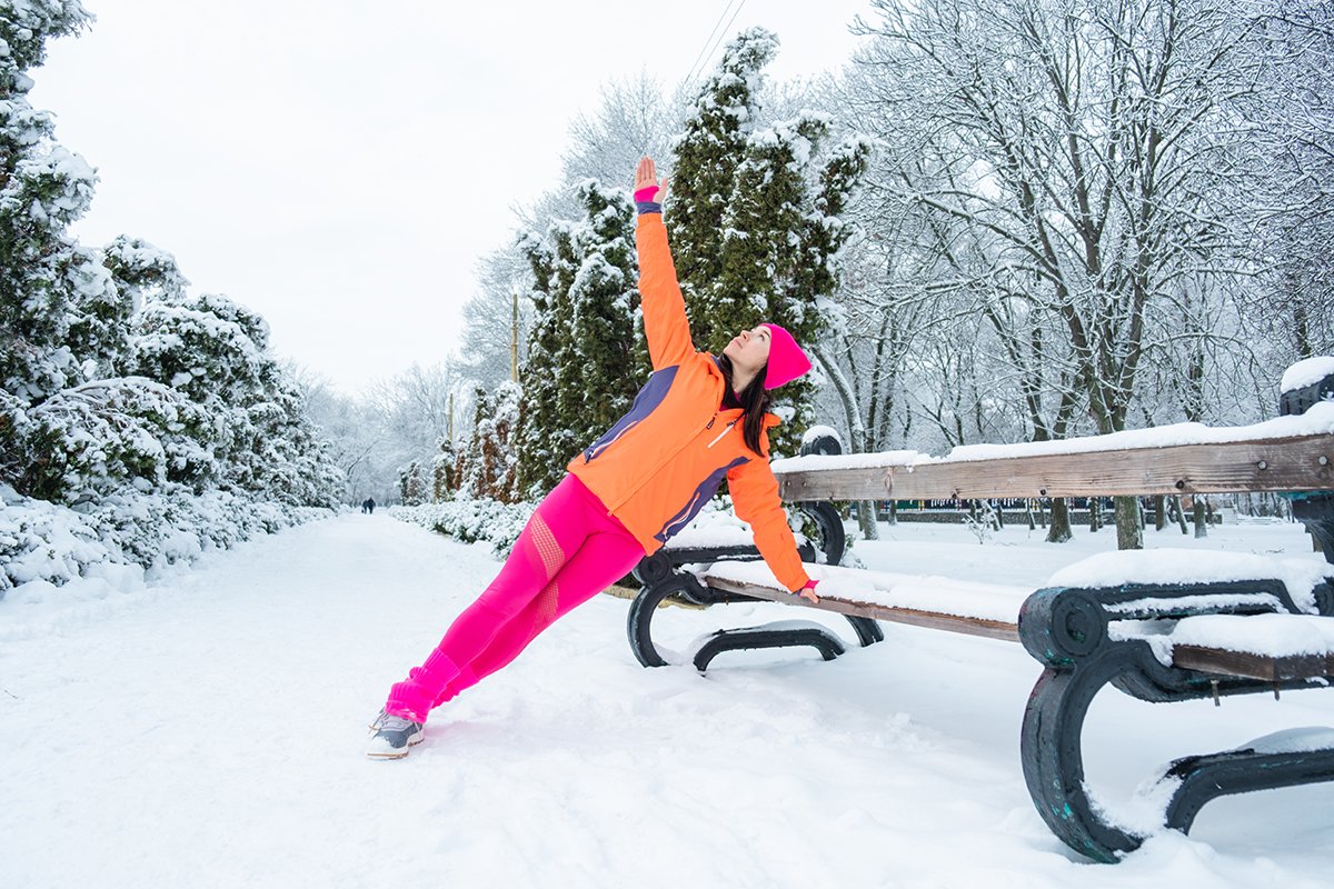Woman exercising outside in winter