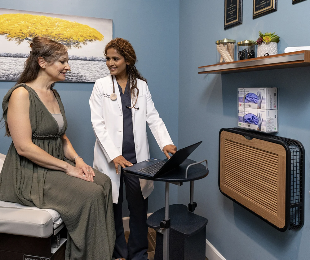 Dr. Sayana with a patient